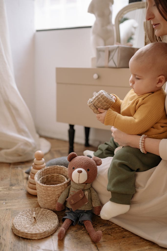 A Baby Playing with a Basket