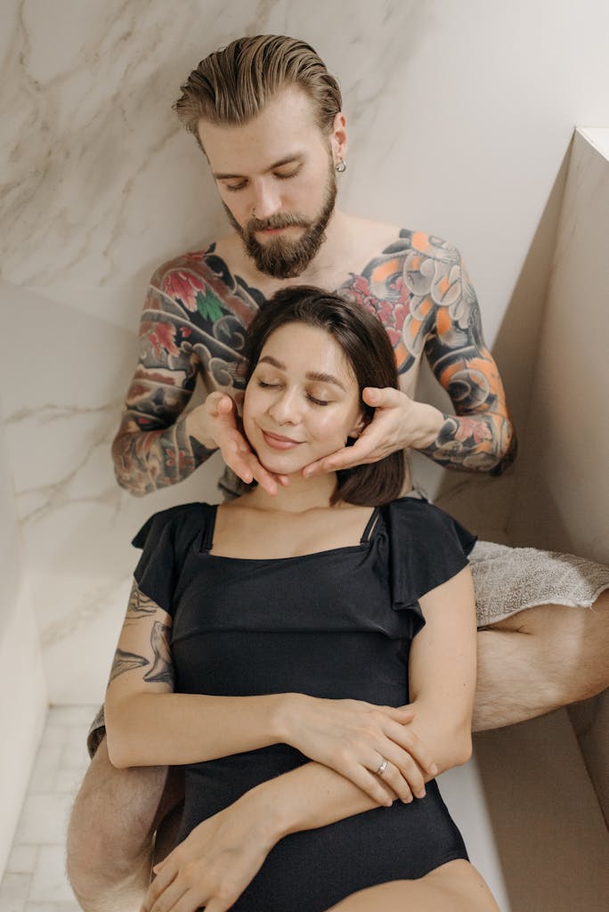 A Bearded Man Massaging His Woman