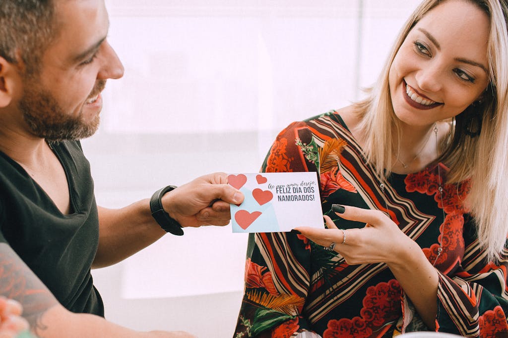 A Woman Receiving a Valentine's Card from a Man